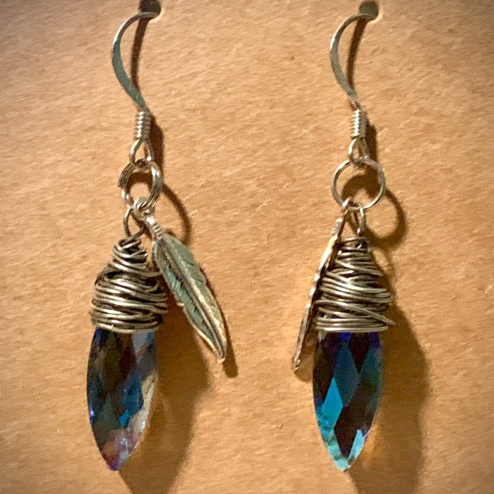 Blue topaz colored silver drop earrings with feather